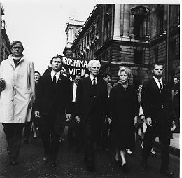 Person(s) in Photograph: Bertrand Russell, Edith Russell, Ralph Schoenman, Rev. Michael Scott. Description: Photograph of Bertrand, Edith and Ralph Schoenman leading the Hiroshima Vigil march from the Cenotaph to Hyde Park. Archive Box Number: RA3 Rec. Acq. 1327 Date: 1961