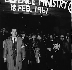 Person(s) in Photograph: Bertrand Russell, Edith Russell Description: This is a photograph of Bertrand Russell, Edith Russell, Ralph Schoenman et al. leading a march to the Ministry of Defence for a "sit-in" on February 18, 1961. Archive Box Number: RA3 Rec. Acq. 1327 Date: 1961