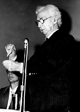 Person(s) in Photograph: Bertrand Russell Description: This photograph shows Bertrand Russell tearing up his Labour Party membership card after announcing in October 1965 his resignation from an organization to which he had belonged for nearly fifty years. This action was taken in protest of the Labour Government's support for the policy of the United States in Vietnam. Archive Box Number: 5,6 Date: 1965