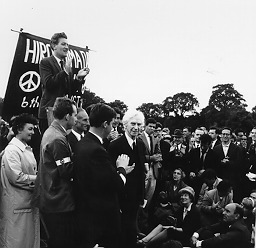Person(s) in Photograph: Bertrand Russell Description: This is a photograph of Bertrand Russell smiling after he had given his speech at the Hiroshima Vigil in Hyde Park on August 6, 1961. Russell was prevented from completing his address by police who instructed him that the use of a microphone contravened Park regulations. The meeting adjourned to Trafalgar Square. Russell's participation in the day's events led to his serving a week-long prison sentence for inciting the public to acts of civil disobedience. The Russell Archives have film footage of this too. Archive Box Number: RA3 Rec. Acq. 1327 Date: 1961