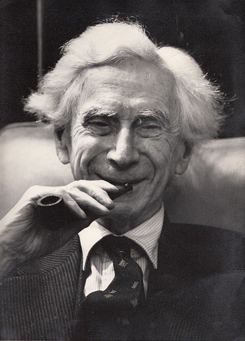 Bertrand Russell smiling with a smoking pipe